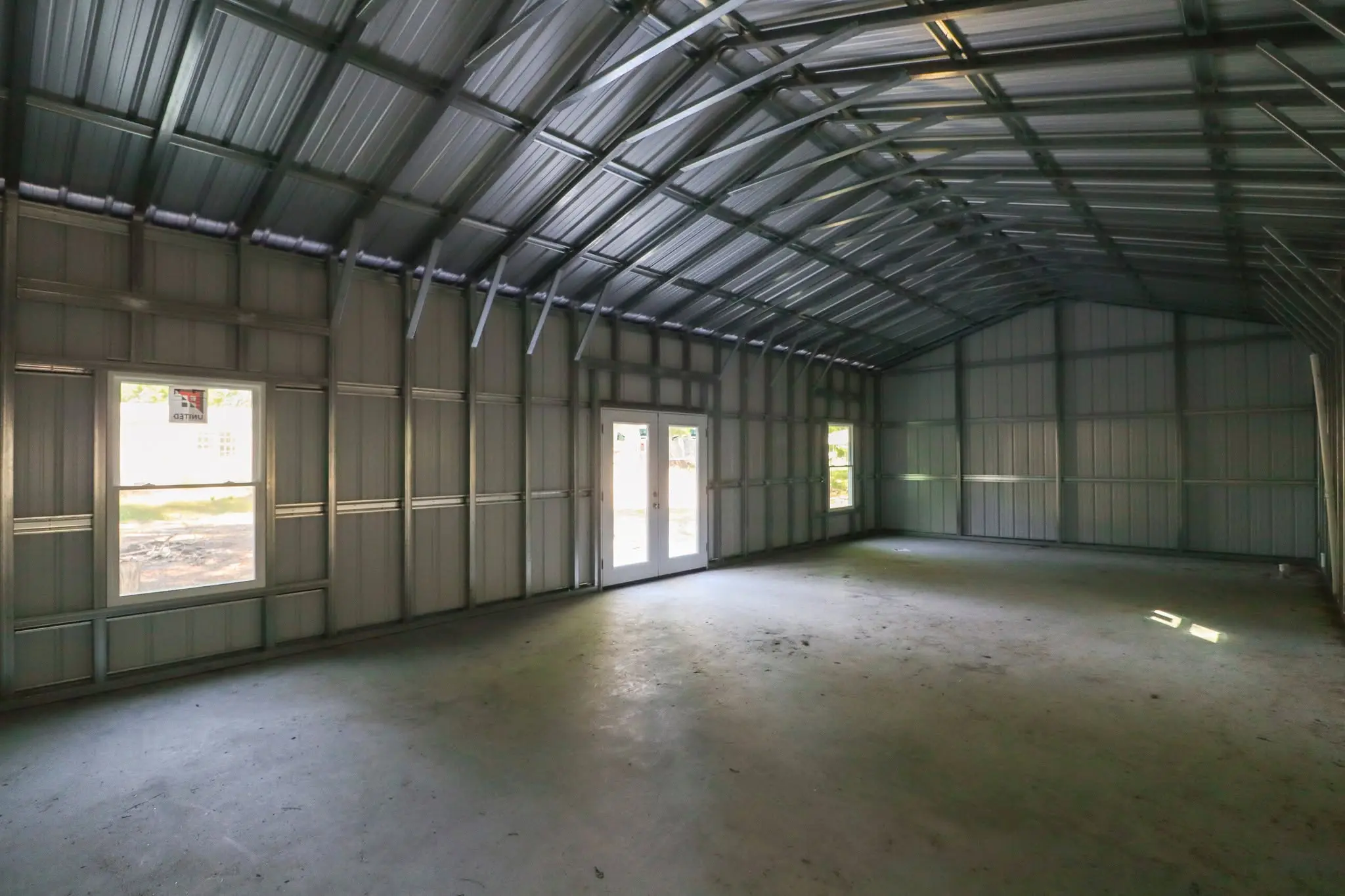 Interior steel framing with windows and double doors