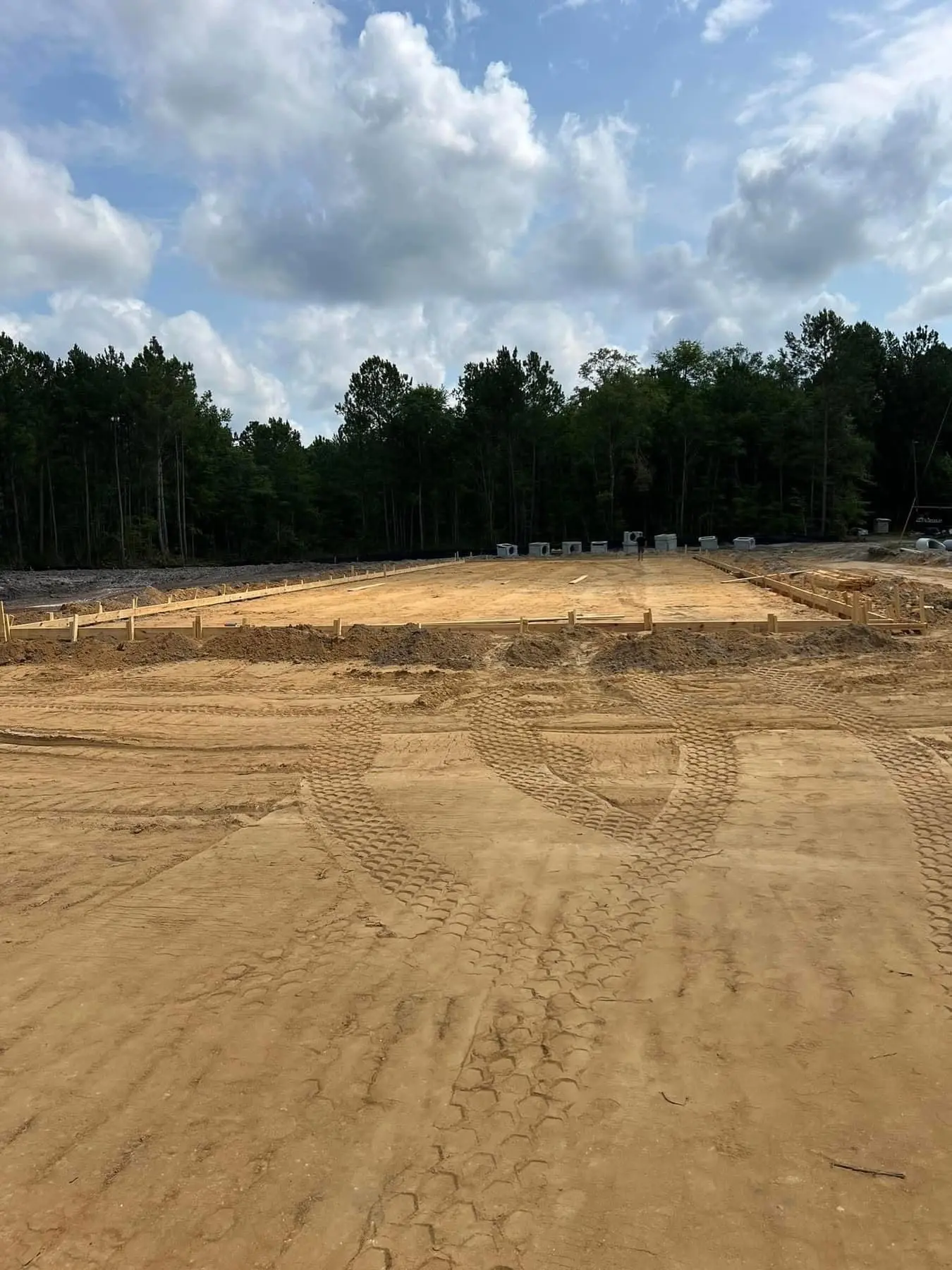 Prepared building pad with wooden concrete forms