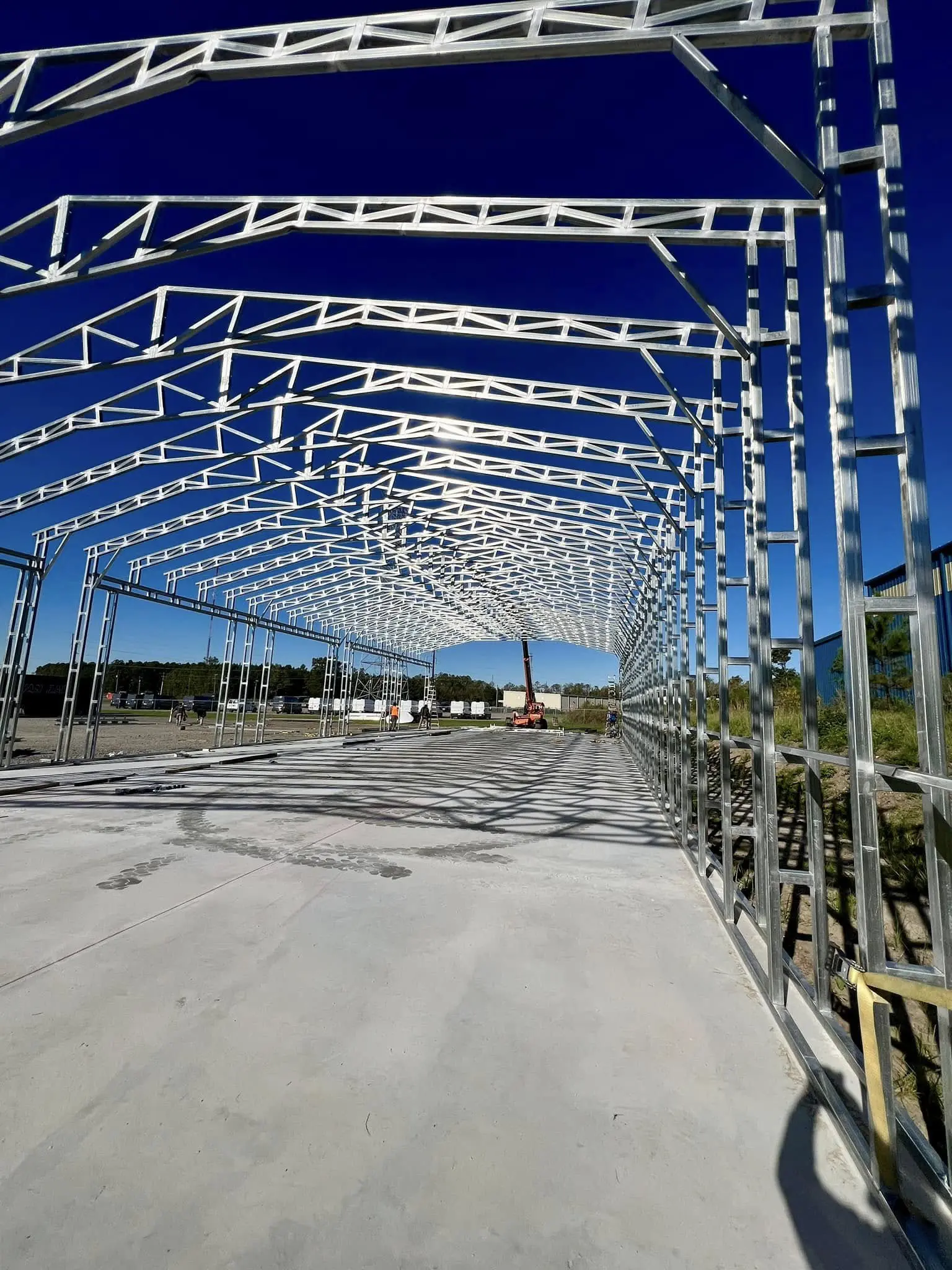 Interior view of commercial steel framing before roof installation