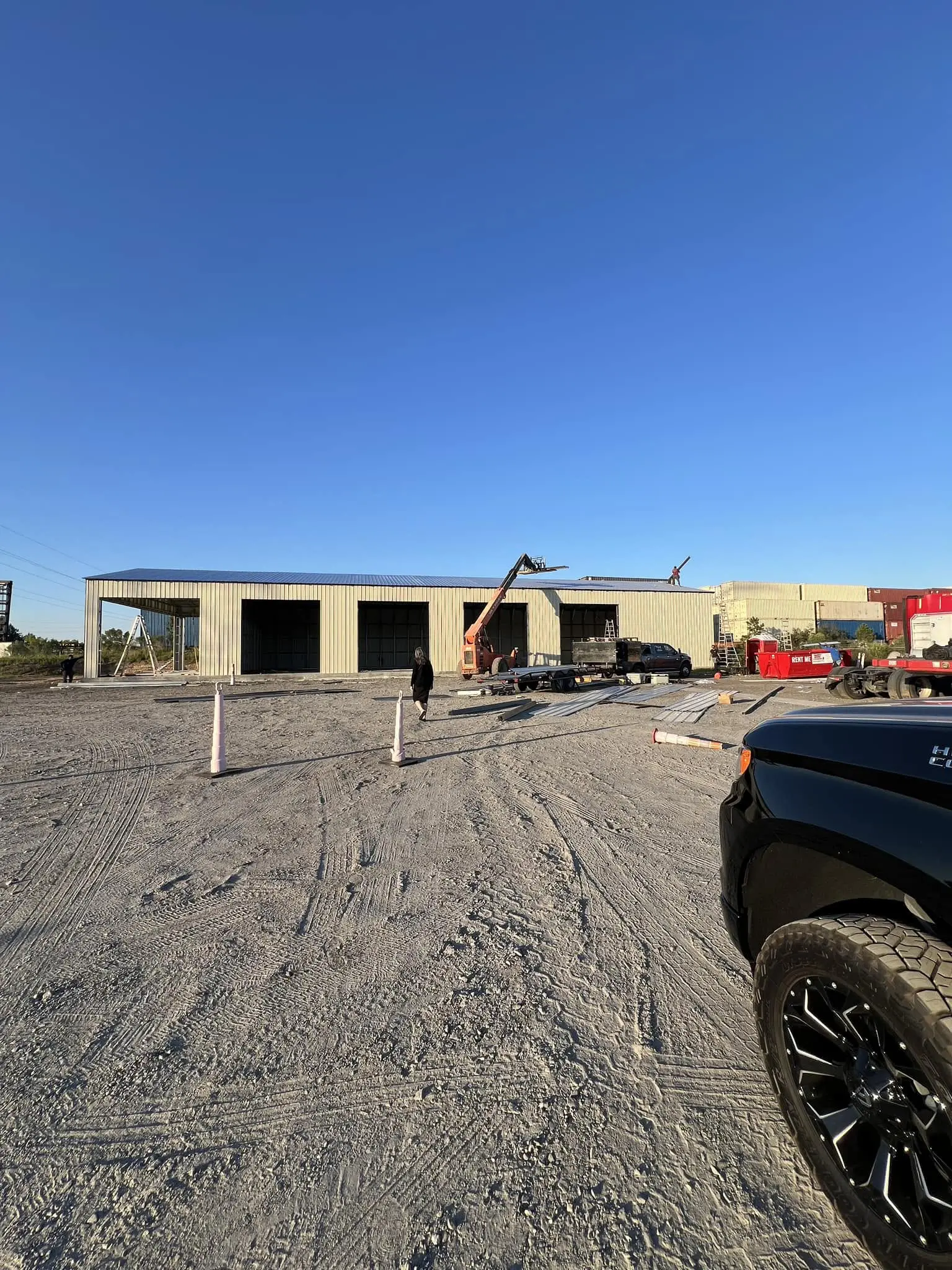 Commercial steel building during siding installation