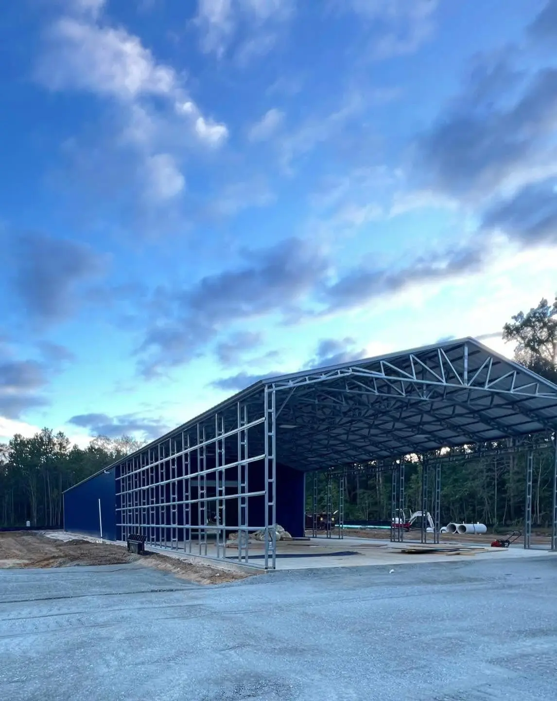 Large steel building during roof and wall installation